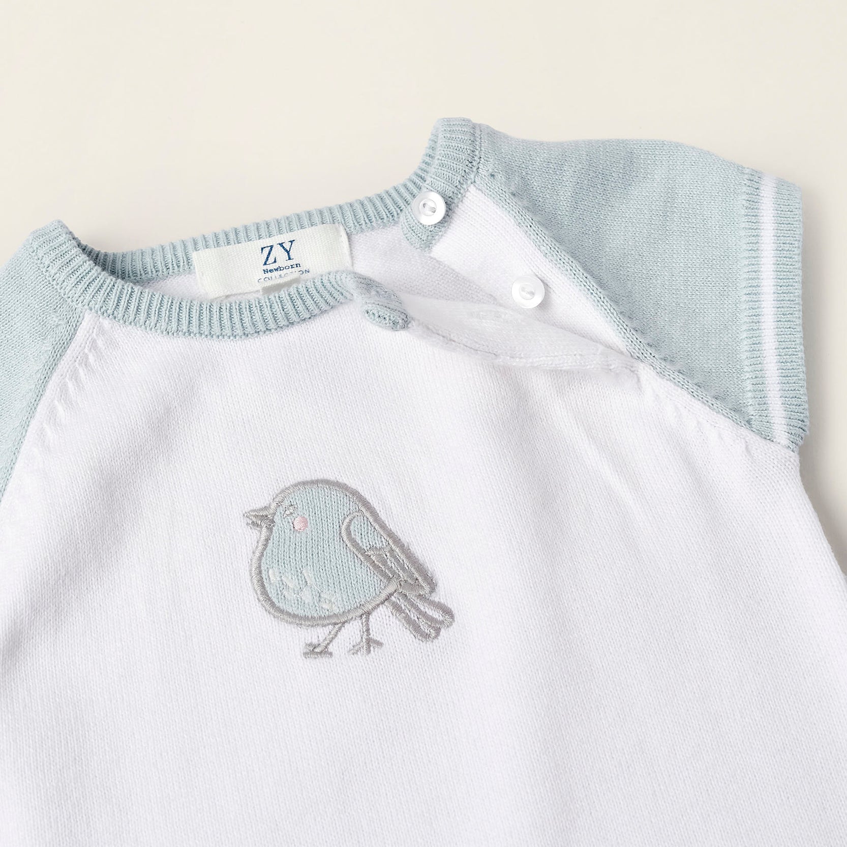 Short Knit Romper for Newborns 'Bird', White/Blue